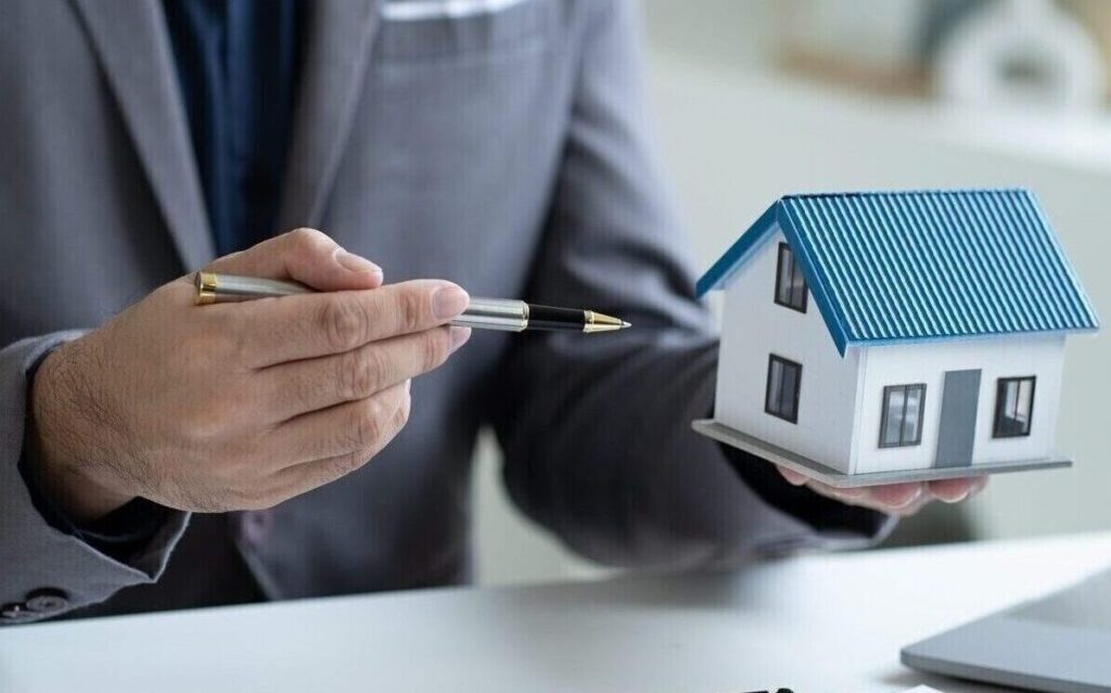 Close up Real Estate agent explain signing agreement for buying house. Bank manager and real estate