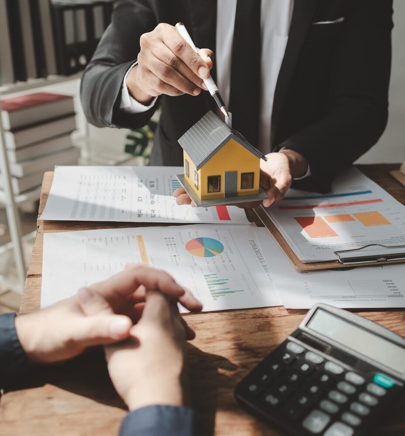 Talking with a real estate expert, Discuss property investments, A customer is having a financial me